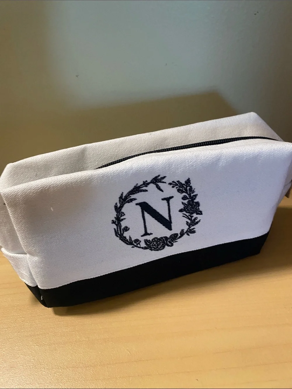 Initial N black and white lined toiletry bag